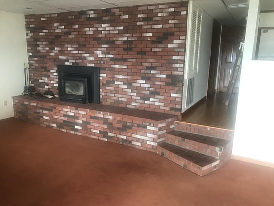 Brick fireplace, before Old New England Rounds natural stone application.