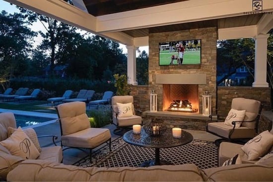 Fieldstone Dark Fireplace and outdoor living space