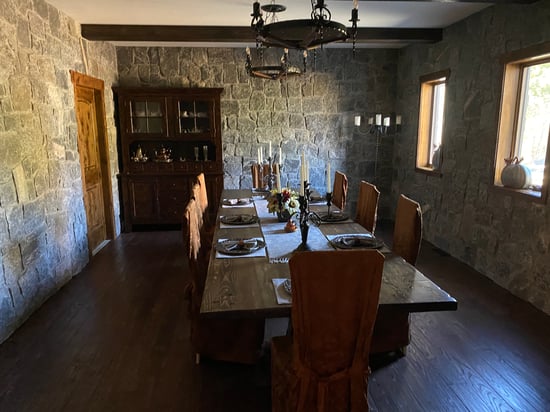 dining room with natural stone walls