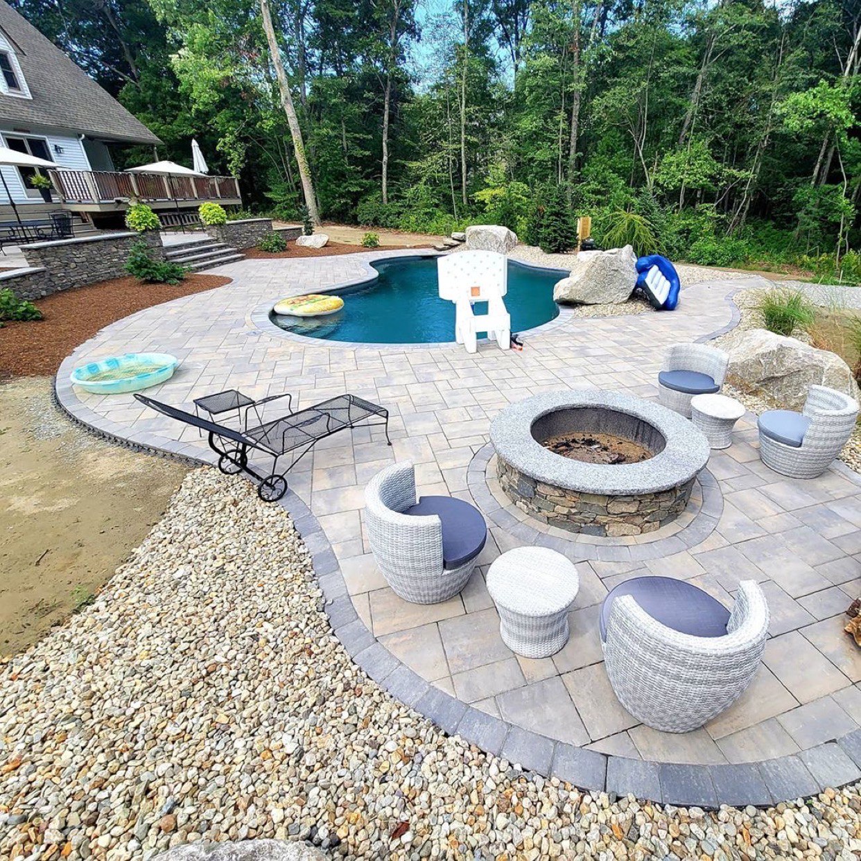 Outdoor Pool Area With Natural Stone Veneer Features