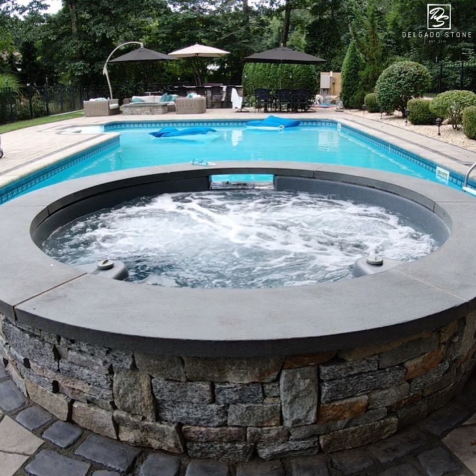 Spill Over Spa With Natural Stone Veneer