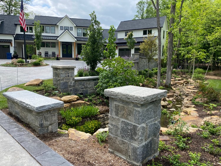 Liberty Hill Pillars, Landscape Walls and stream area with home in the background.