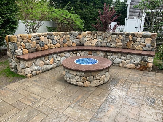 Old New England Rounds natural stone firepit and seating wall
