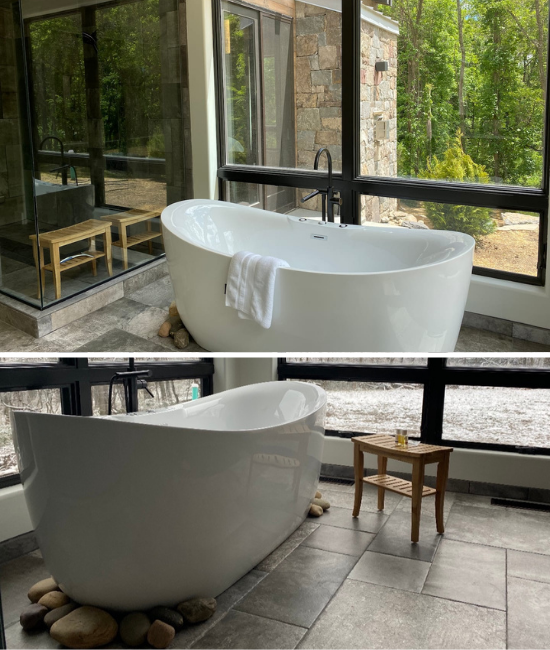 Bathtub with large windows and accent stones